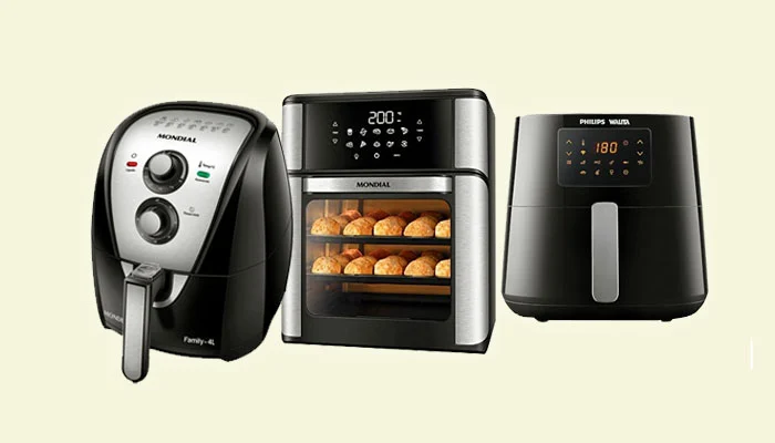 Uma variedade de air fryers de diferentes marcas e modelos em uma bancada de cozinha moderna, ilustrando um comparativo